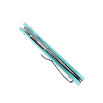 Compact utility knife shown open with textured grip and satin blade