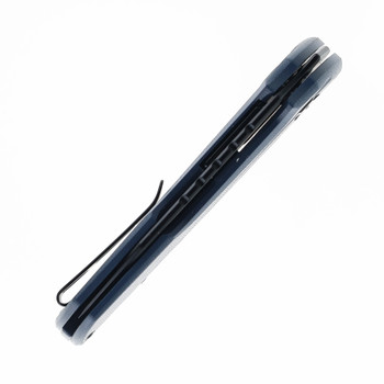 Closed carry knife with textured scales in a minimal studio view