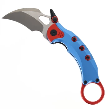 Maxace Blacklight Karambit folding knife blue-red handle in a display.