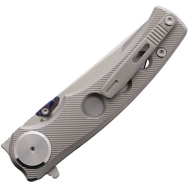CobraTec Maverick button lock folding knife with fluted titanium handle.