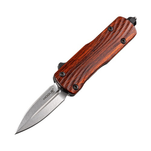 Hogue micro counterstrike auto knife sits on a rustic wooden table.