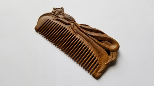 A beautiful hand carved Fox Design Vintage Style Wood Comb on both sides on the natural sandalwood comb.  Find unique natural combs at Arakicrafts!