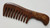 A brown wooden comb with a gold floral design on the handle. This comb is designed for detangling.