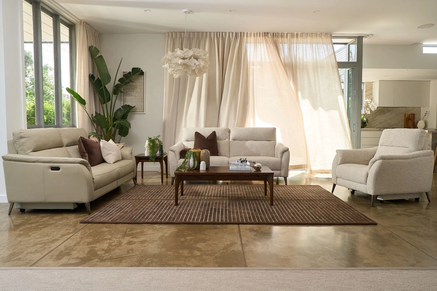 Bailey Sofa styled soft and neutral with cream cushions and a natural rug