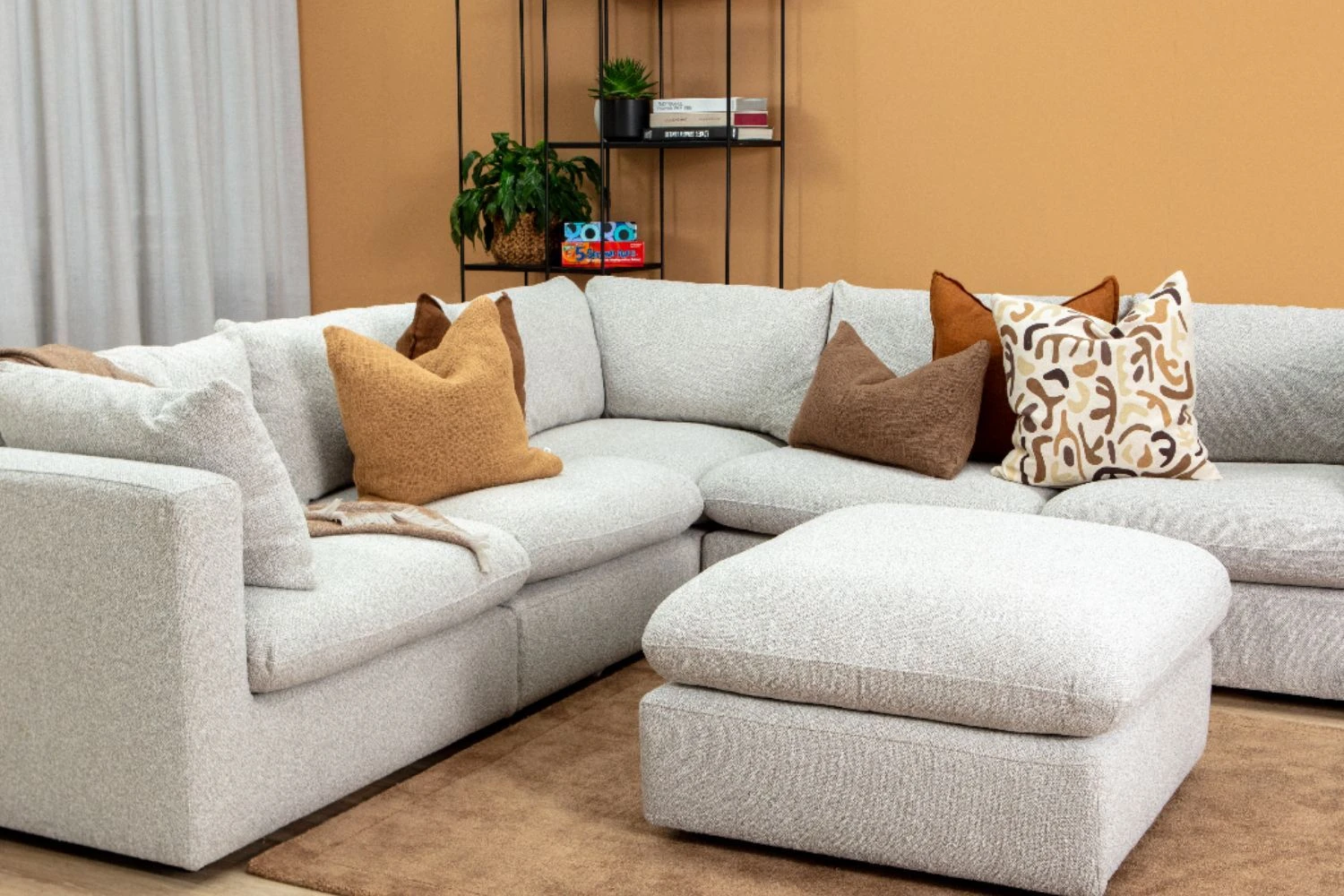 Cushion layering detail showing large and small cushions with mixed textures