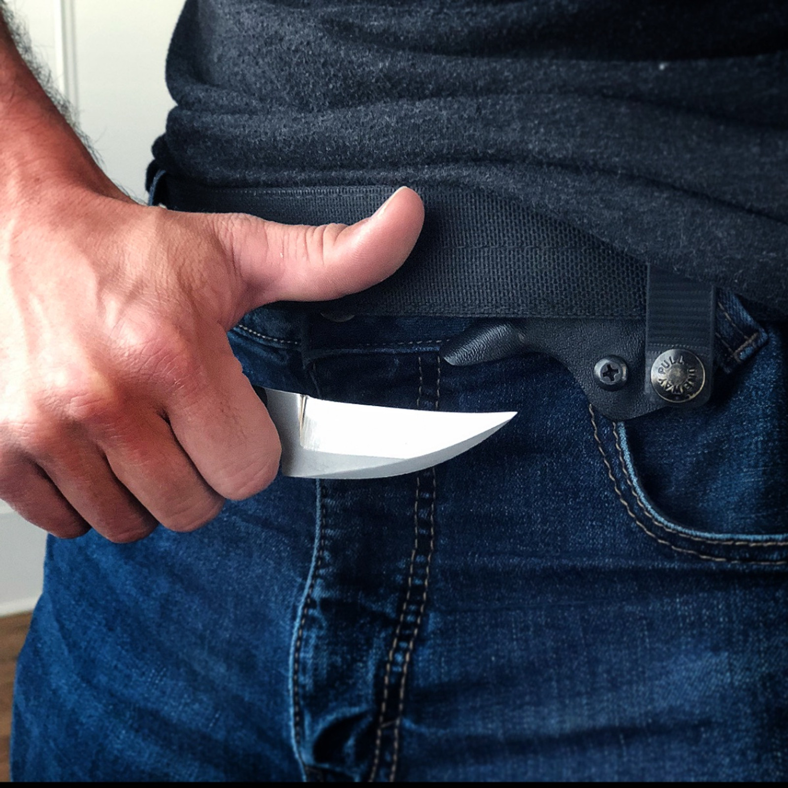 man holding the WPS clinch pick knife
