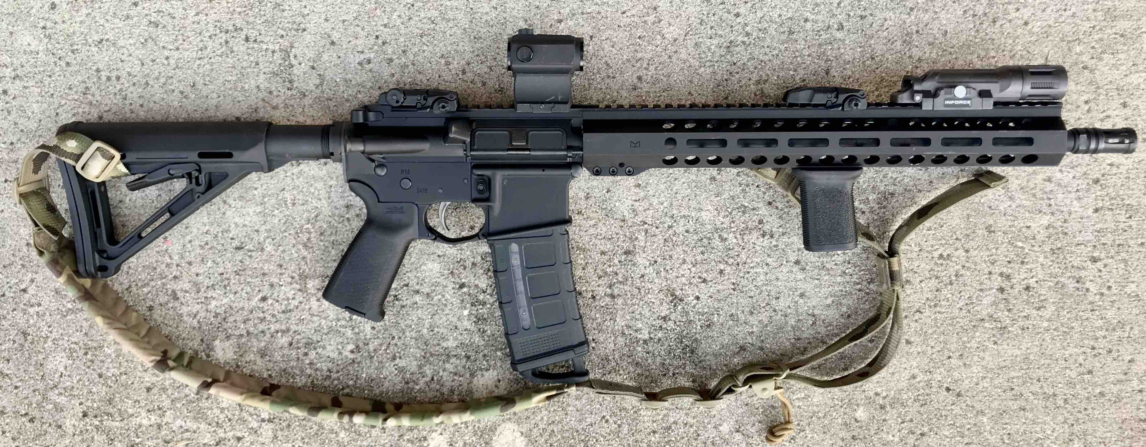 Budget AR-15 setup is a Palmetto State (PSA) with Magpul furniture, an Info...