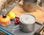 Ultralight titanium cook pot on camping stove during backpacking trip