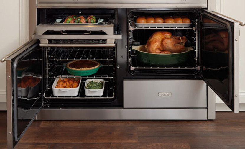 AGA Elise Induction Range 48-Inch Antique Brass Handle Stanchion and Knobs in Gloss Black