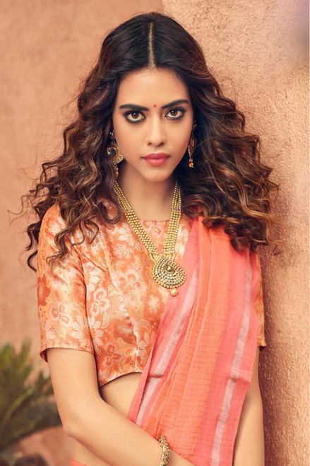 Pure Linen by Linen Checks Peach Coloured Saree with Knotted Tassel Pallu. Pure Linen by Linen Checks Peach Coloured Saree with Knotted Tassel Pallu.