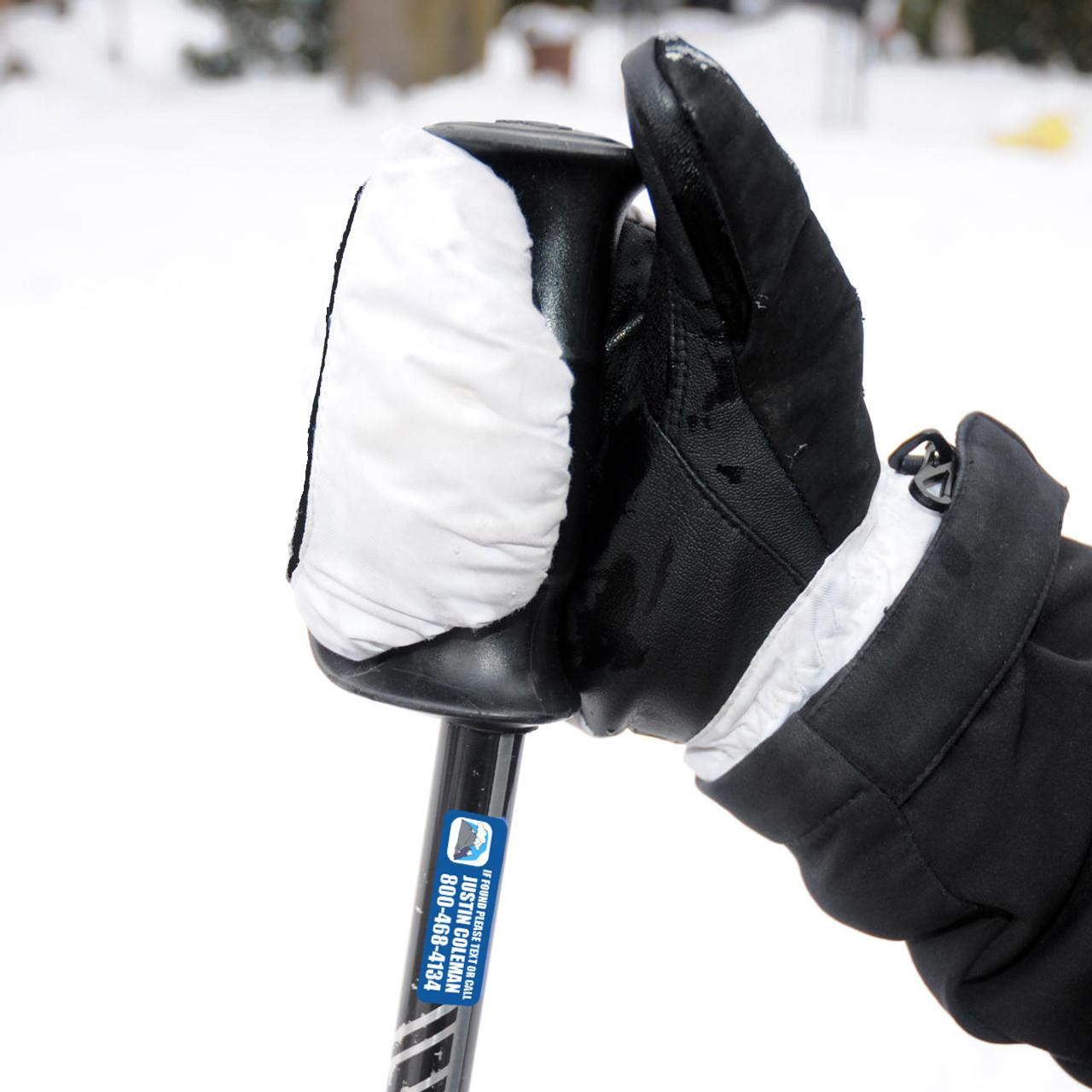 Stinky Lockers Personalized Ski Stickers-Skis, Pole & More That Last, close-up of a ski pole with a white cover on the handle, used on a snowy mountain with blurred background.