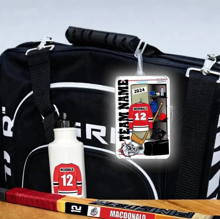Stinky Lockers Personalized Hockey Team Combo – Bag Tag, Stick & Water Bottle Decals on a sports bag with hockey equipment.