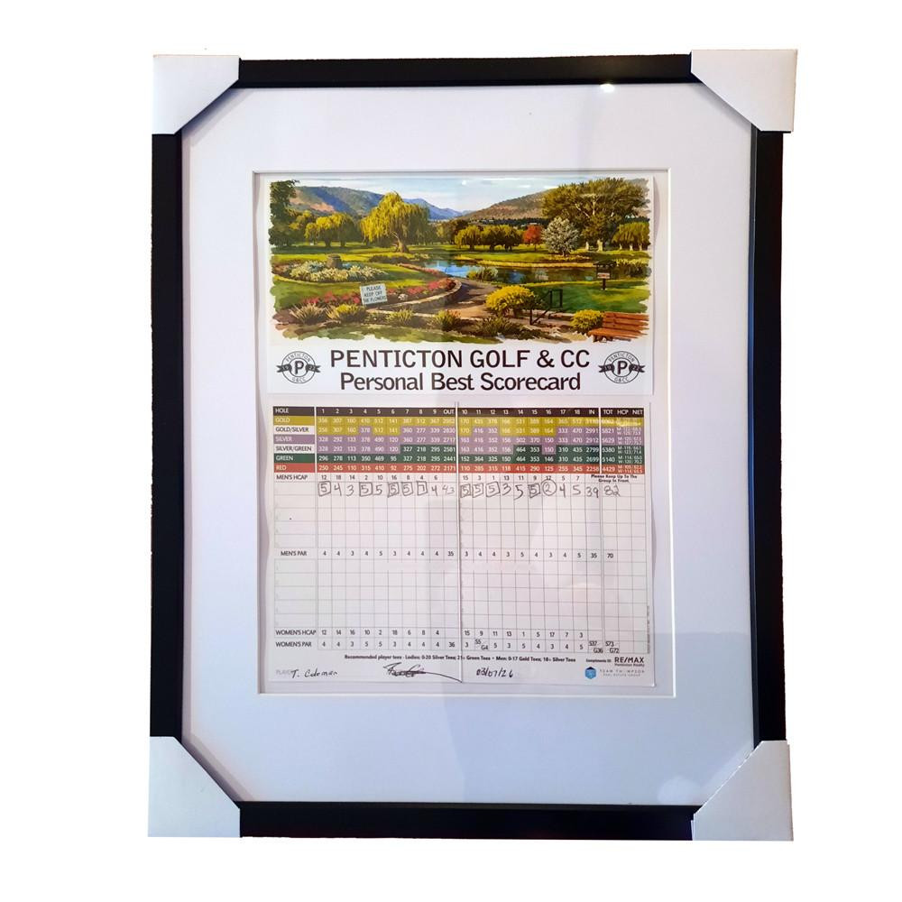 Framed Golf Course Watercolor Print – Add Your Scorecard Keepsake | Golf Course Memory Frame, featuring a watercolor print of a golf course landscape with a personal golf scorecard displayed beneath.