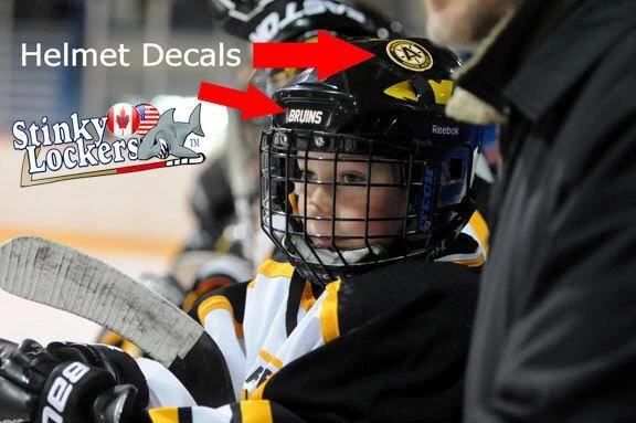 Stinky Lockers Personalized Hockey | Ringette | LAX Sticker Pack - Duplicate OTO, image of a young hockey player wearing a helmet with decals and stickers at an ice rink.