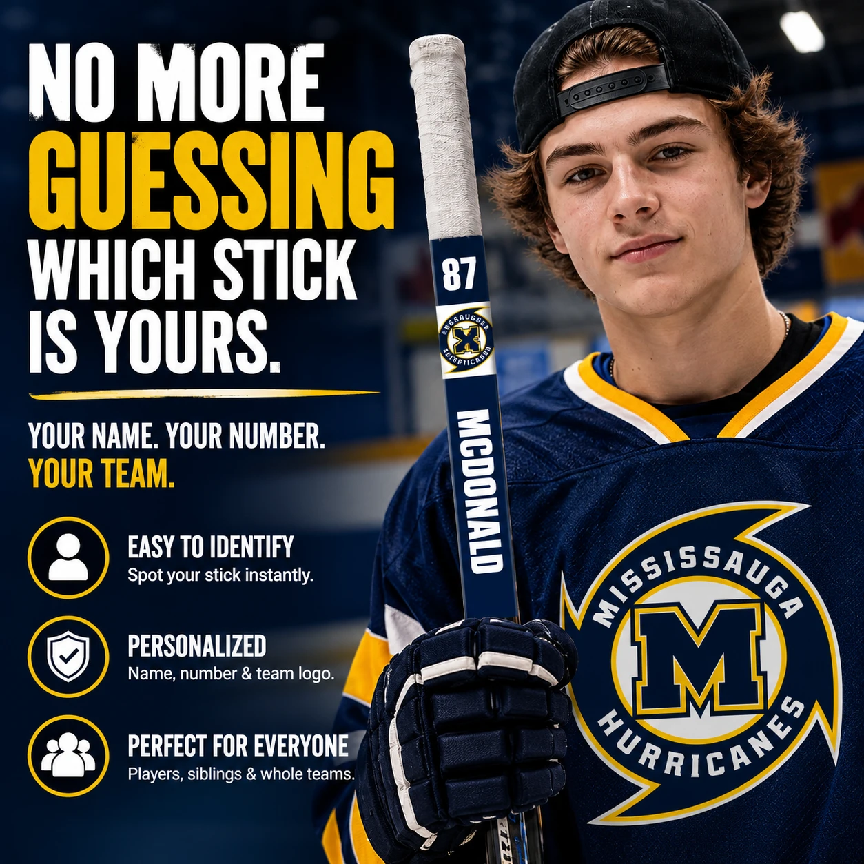Mississauga Hurricanes hockey player holding a stick personalized with MCDONALD 87 and a navy blue and gold Hurricanes logo decal. Custom hockey stick identification sticker for players and teams.