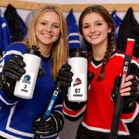 Stinky Lockers Personalized Ringette Sticker Pack – Power Play Pack, two women hockey players holding personalized water bottles and hockey sticks with team and player stickers.