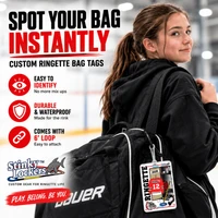 Stinky Lockers Personalized Ringette Luggage Tag with Loop-OTO, a photo showcasing a customized ringette-themed luggage tag attached to a black sports bag, featuring gear and a team logo.