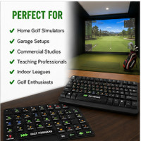 Golf simulator home setup featuring a keyboard with shortcut stickers for quick access to common GSPro-compatible commands during indoor golf practice.