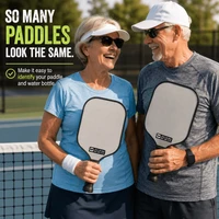 Stinky Lockers Personalized Pickleball Paddle Waterproof Decal Pack, two pickleball paddles with custom stickers for easy identification at a tennis court.