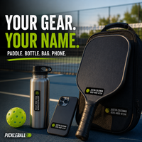 Stinky Lockers Personalized Pickleball Paddle Waterproof Decal Pack, two pickleball paddles with custom stickers for easy identification at a tennis court.
