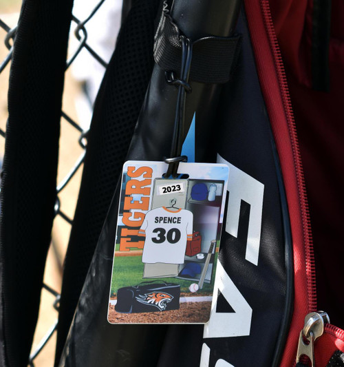 Stinky Lockers Baseball ID Add-On Pack – Extra Name Decals & Gear Stickers, a set of personalized baseball-themed badges hanging on a sports bag.