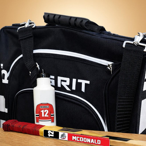 Stinky Lockers Stick Label & Pro Jersey Water Bottle Decal Combo, sports-themed water bottle with a hockey jersey design and a hockey stick label on a wooden surface.