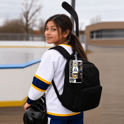 Stinky Lockers Mississauga Hurricanes Personalized Hockey Bag Tag – Custom Name & Number, personalized hockey bag tag displaying a custom player name and number on a black hockey backpack worn by a player at the rink.