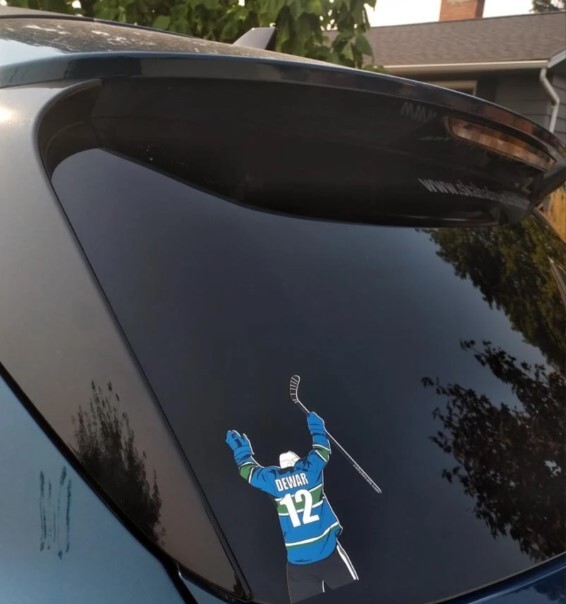 Two personalized hockey car window graphics