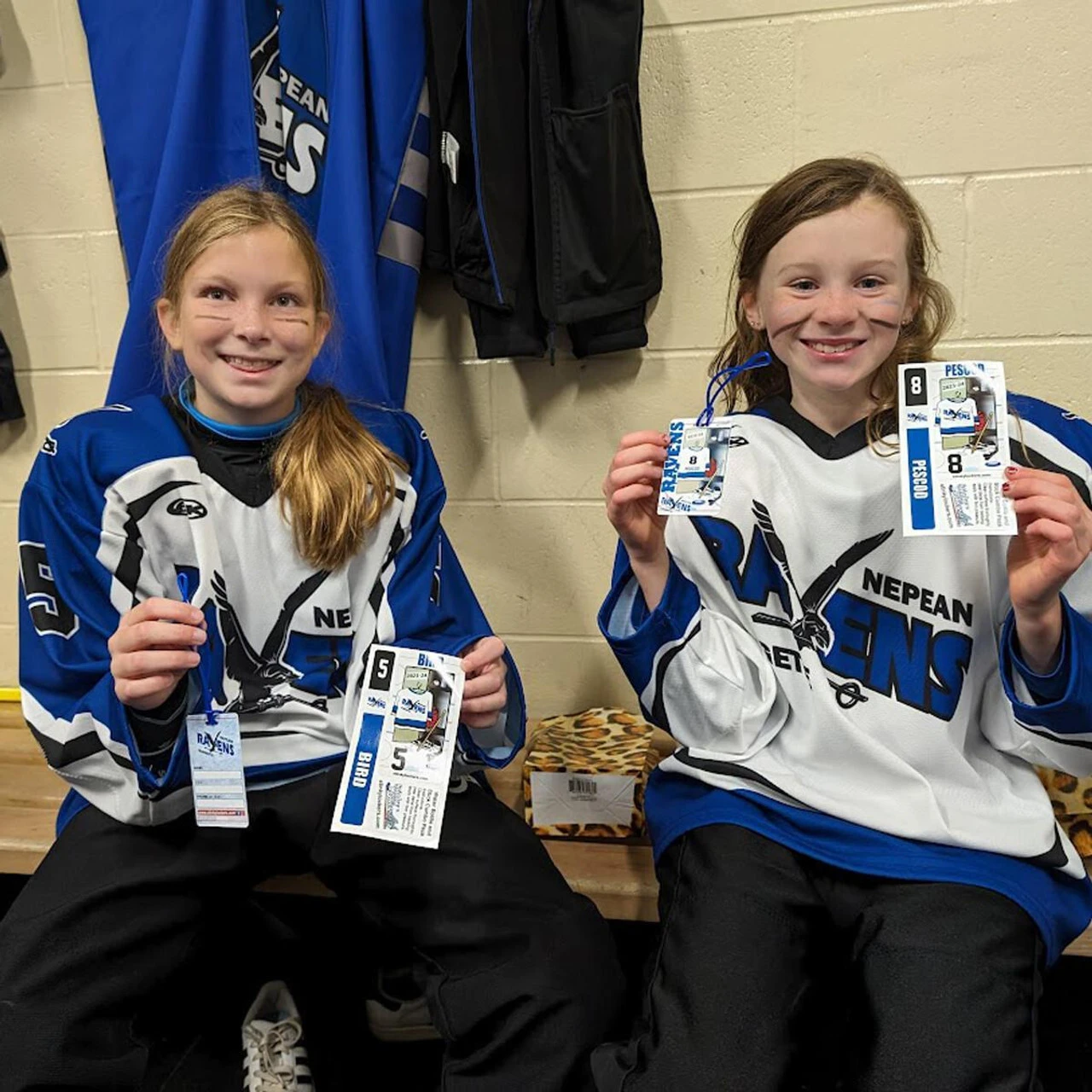 Youth hockey players with personalized Stinky Lockers hockey products