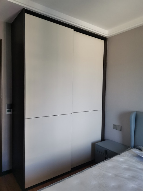 Custom sliding door wardrobe in Singapore bedroom — Shuno by Arimokko, full front view