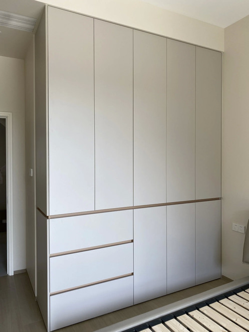 Custom casement wardrobe in Singapore bedroom — full-access hinged doors by Arimokko Shuno