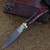 Ember in Veins Damascus Steel Clip Point Switchblade