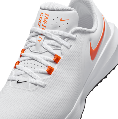 orange and white nike golf shoes