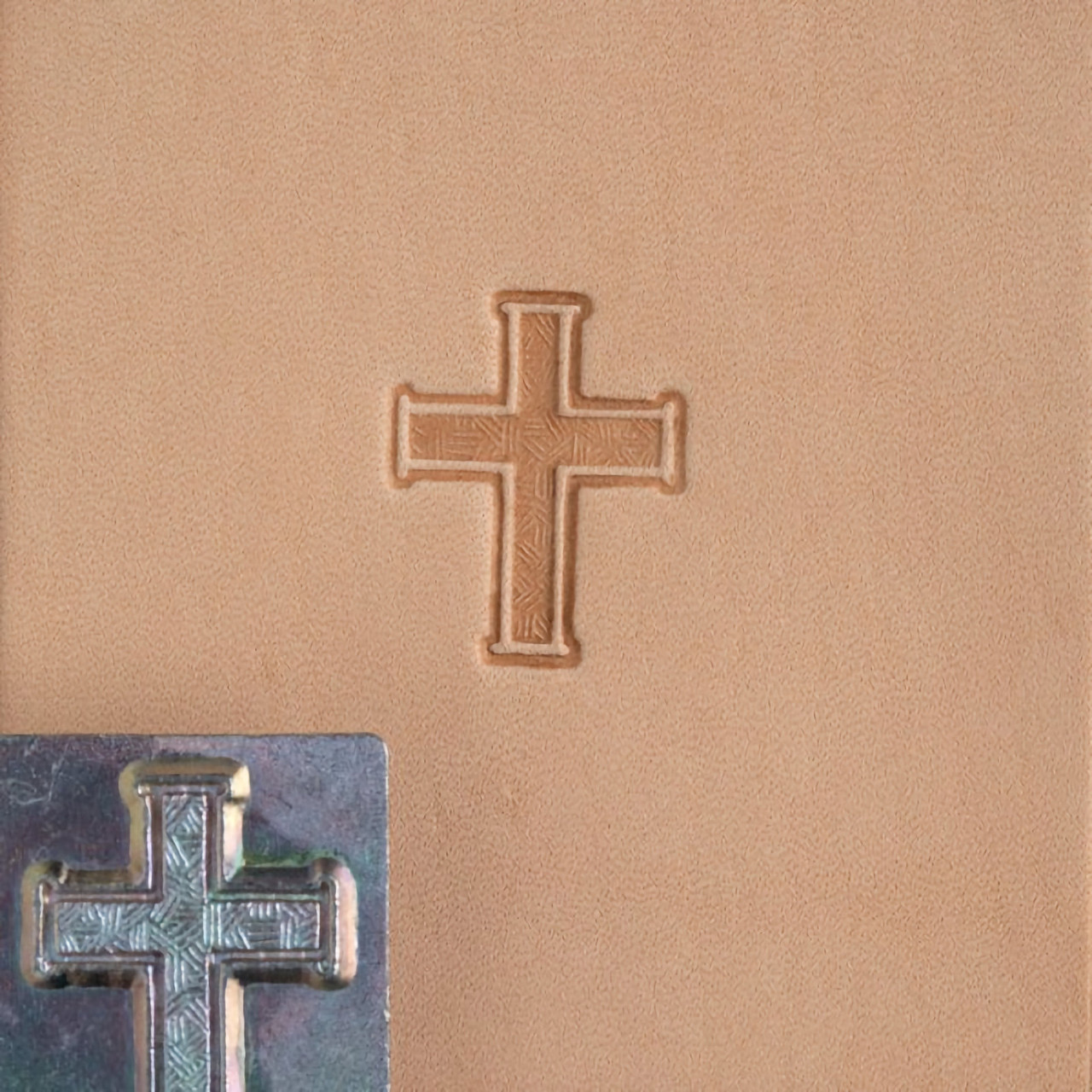 Cross stamp with its leather impression.