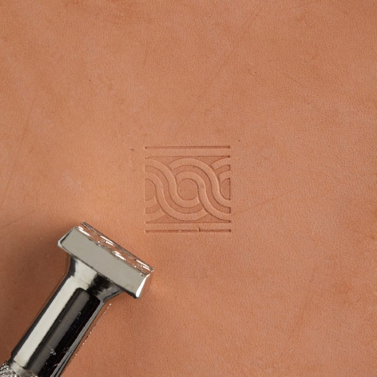 Geometric stamp with its leather impression.