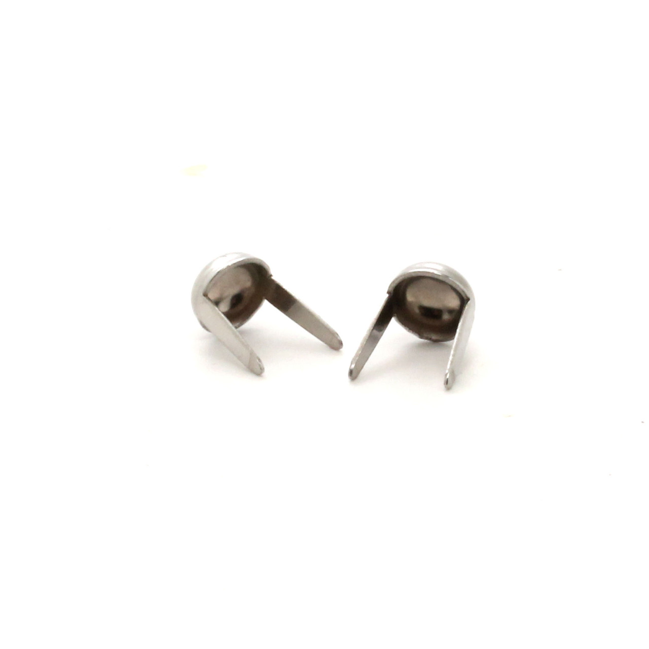 Back side of a 1/4" round stainless steel spot.