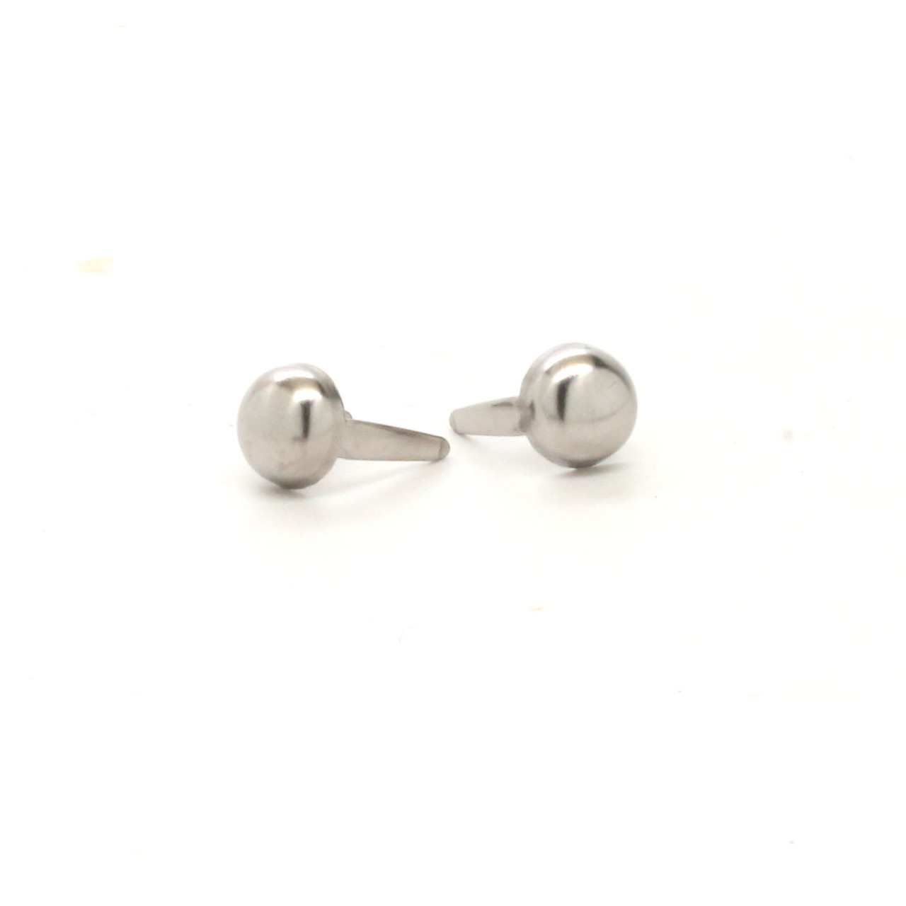 Front side of a 1/4" round stainless steel spot.