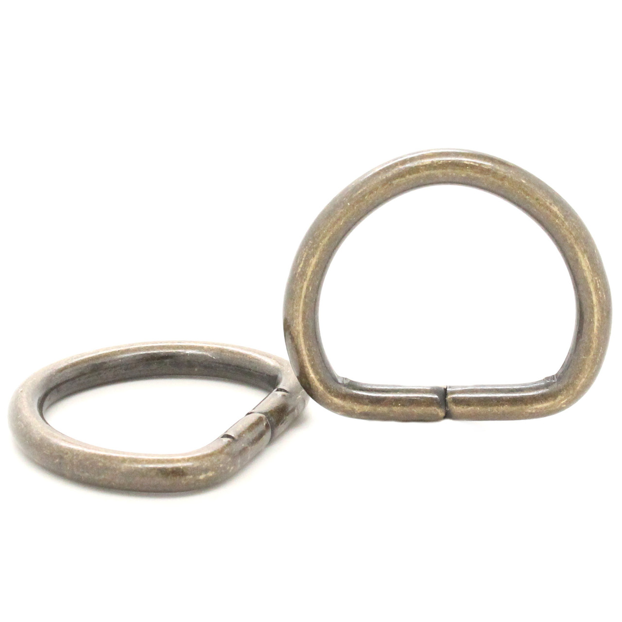 Pair of 1" antique brass d-ring.