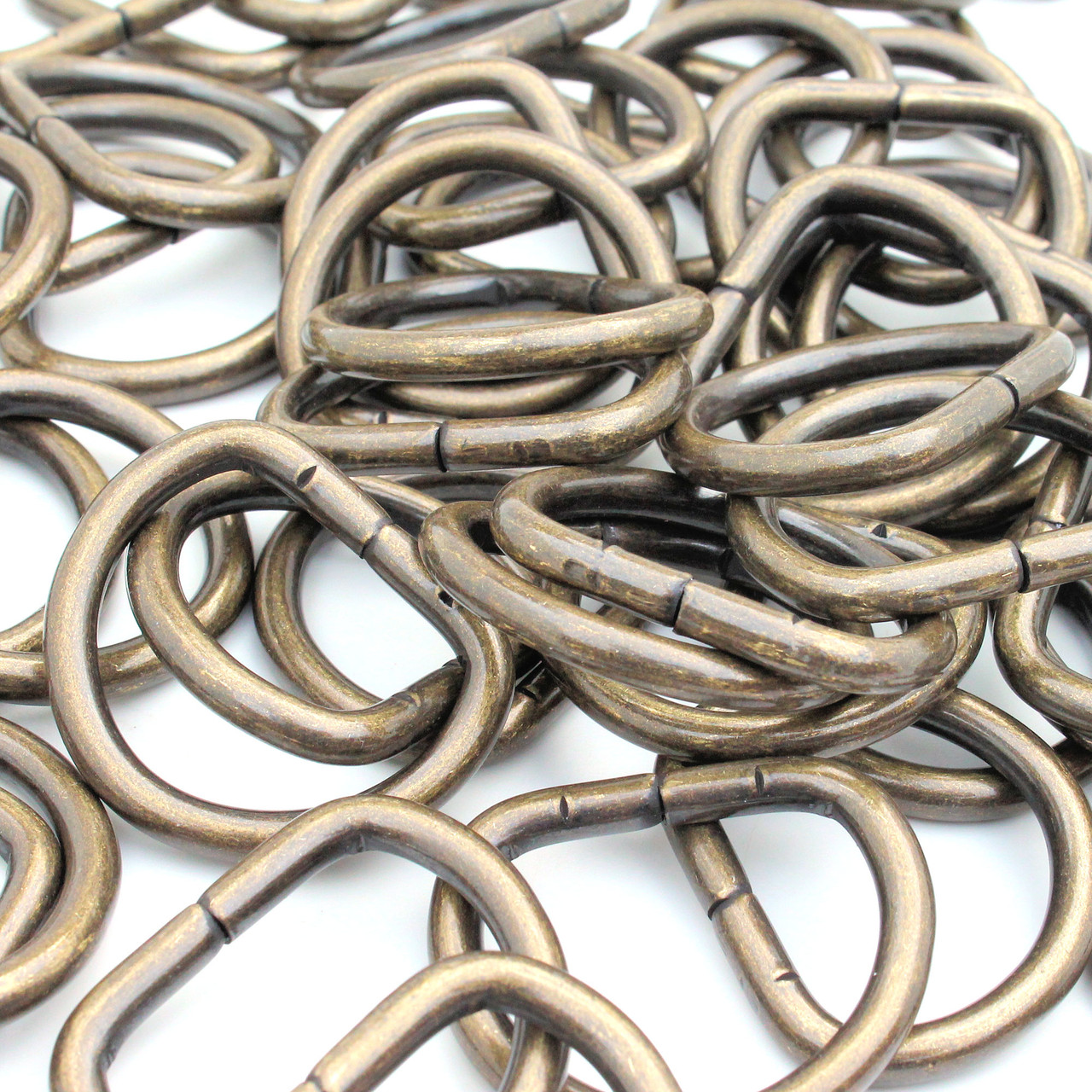 Grouping of 1" antique brass d-ring.