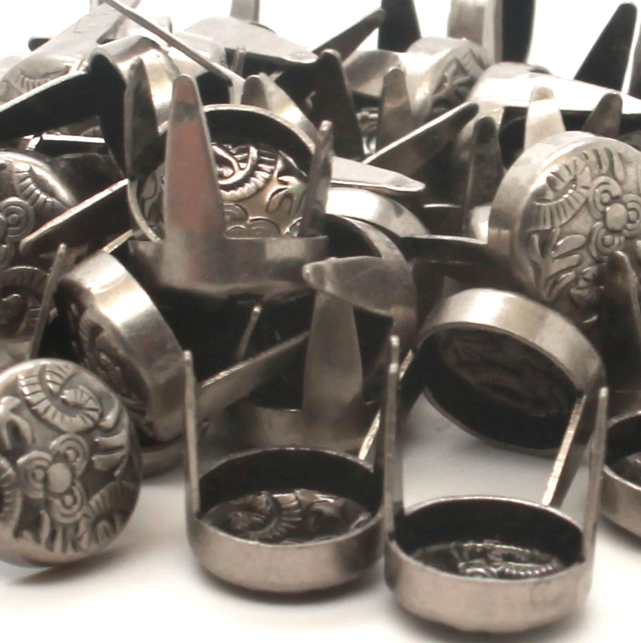 Bulk pack of solid brass flower embossed round spots finished in antique nickel.