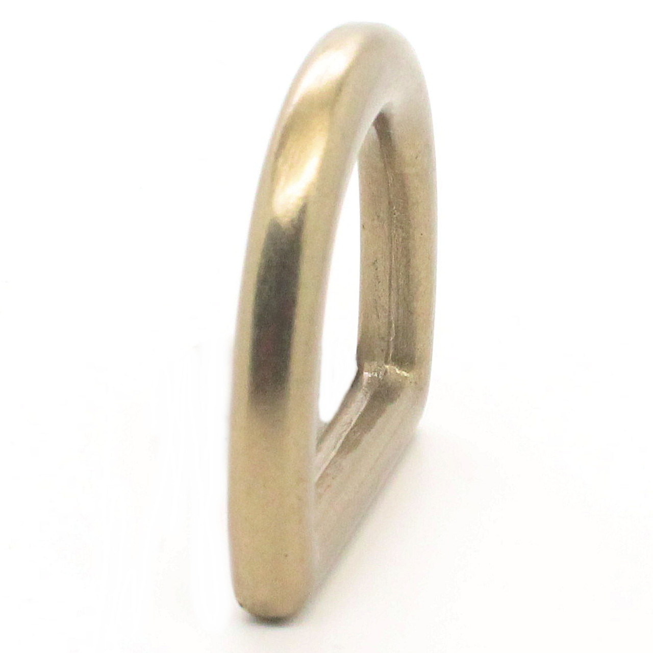 D-Ring in 1" finished in matte antique brass side.