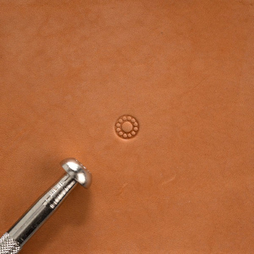 Flower center leather craft stamp with its impression.