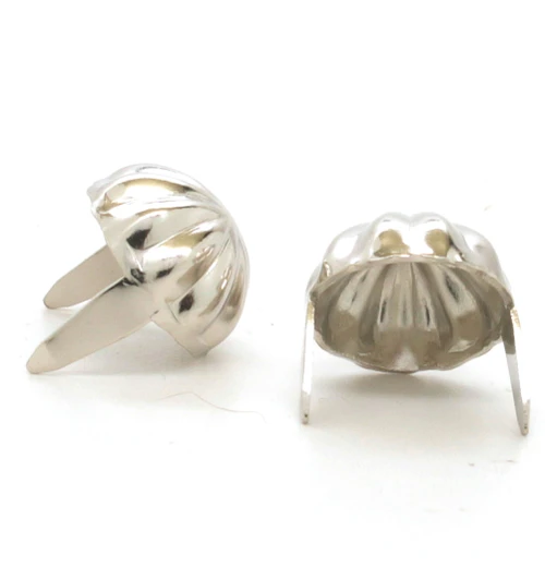 Brass and nickel parachute spot in 100 packs showing the backs.