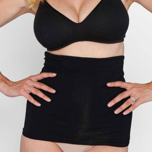 Angel Maternity black tummy control belly band shapewear worn over underwear, shown on torso with hands on hips