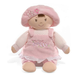 Gund My First Dolly soft baby doll with brunette hair, pink dress, floral hat and embroidered face on white background