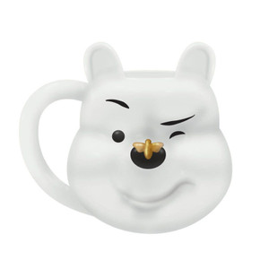 Disney white Winnie the Pooh shaped ceramic mug with gold bee nose detail and bear ears, side view on white background