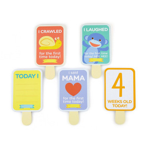 Pearhead baby milestone cards on wooden sticks featuring colourful designs for crawling, laughing, mama and age tracking