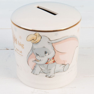 Disney Dumbo ceramic money bank in white with gold trim, featuring Dumbo elephant illustration and coin slot on top
