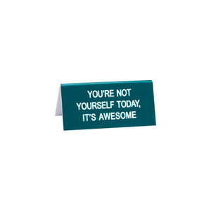 Say What teal desk sign with white text reading 'You're Not Yourself Today, It's Awesome' on white background