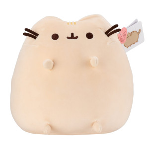 Pusheen beige plush toy in sitting pose with embroidered face, whiskers, small ears and white tag with pink heart